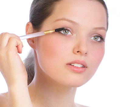 Woman applying makeup